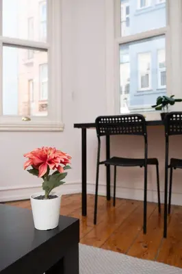a room with a table and two chairs and a flower at Galata Maison by Guest Teori in Istanbul