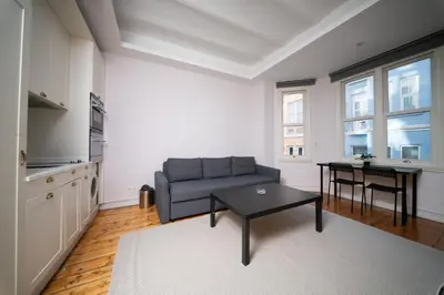 a living room with a couch and a table at Galata Maison by Guest Teori in Istanbul