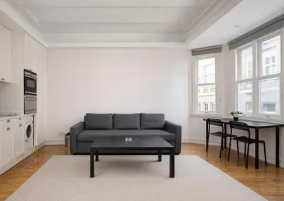a living room with a couch and a table at Galata Maison by Guest Teori in Istanbul