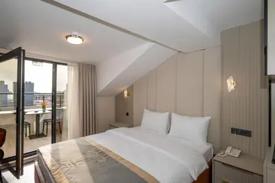 a hotel room with a bed and a balcony at Tumar Istanbul Hotel in Istanbul