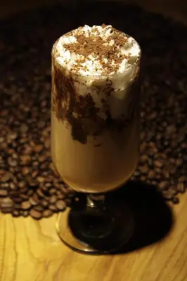 a drink with chocolate and whipped cream in a glass at B Corner Hotel Bistro in Istanbul