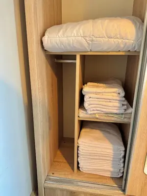 a bunk bed room with folded towels and a pillow at New apartment in the center of Istanbul near Istiklal in Istanbul