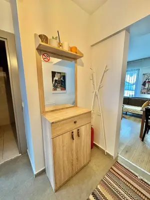 a room with a wooden cabinet in a living room at New apartment in the center of Istanbul near Istiklal in Istanbul
