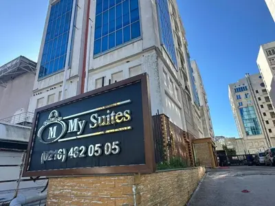 a sign in front of a building at My SUİTES in Istanbul