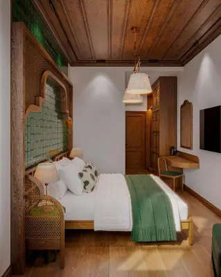 a bedroom with a bed with a green blanket on it at Castellion Hotels Galata in Istanbul