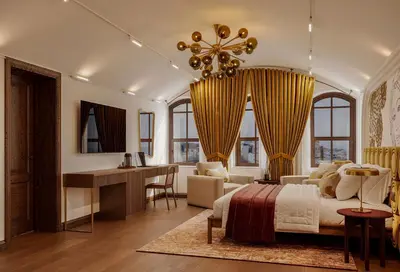 a bedroom with a bed and a desk in a room at Castellion Hotels Galata in Istanbul