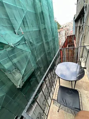 a table and a chair on a balcony at 360 NACRE taksim in Istanbul