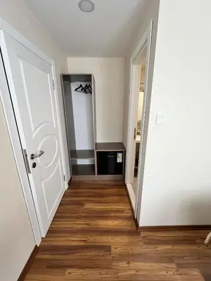 an empty room with a door and wooden floors at 360 NACRE taksim in Istanbul