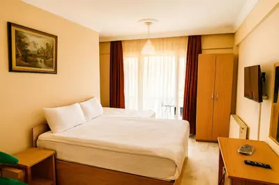 a hotel room with a bed and a window at Lion Stone Hotel in Istanbul
