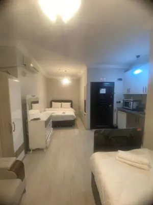 a large room with two beds and a kitchen at historic stay istanbul in Istanbul