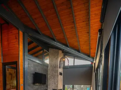 a room with a wooden ceiling and a window at Palmera suit in Sapanca