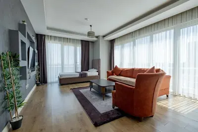 a living room with a couch and a table at My SUİTES in Istanbul