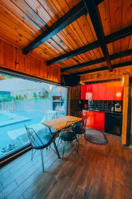 a kitchen and dining room with a table and chairs at Sapanca bungalife in Sapanca
