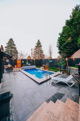 a swimming pool in a yard with a patio at Sapanca bungalife in Sapanca