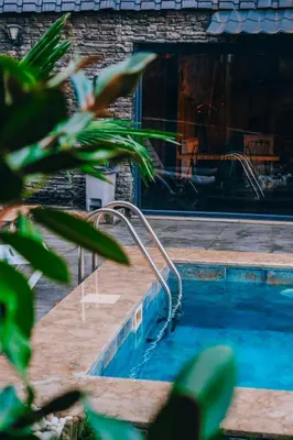 a swimming pool next to a house at Sapanca bungalife in Sapanca