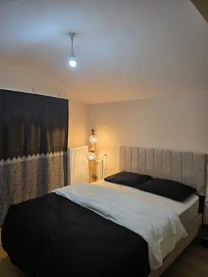 a bedroom with a large bed in a room at Do Not Disturb Suites in Istanbul
