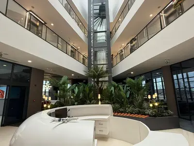 a large lobby with a white tub in a building at H-mak AIRPORT OTEL in Arnavutköy