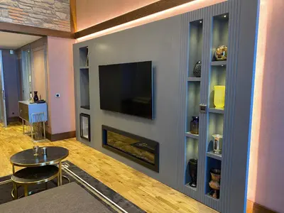 a living room with a fireplace and a flat screen tv at Bof Hotels Uludağ Ski&Luxury Resort All Inclusive in Uludag