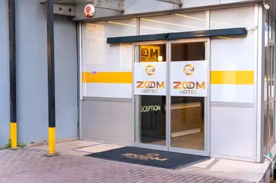 an entrance to a zomon hotel with a sign in the door at Zoom Airport Hotels in Istanbul