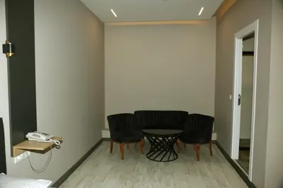 a dining room with a table and chairs in a room at Zoom Airport Hotels in Istanbul