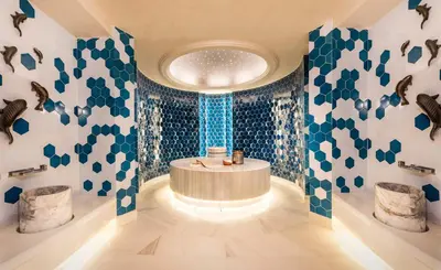 a bathroom with blue and white walls and a round tub at Crowne Plaza Florya Istanbul by IHG in Istanbul