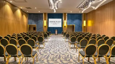 a conference room with rows of chairs in front of a screen at Crowne Plaza Florya Istanbul by IHG in Istanbul