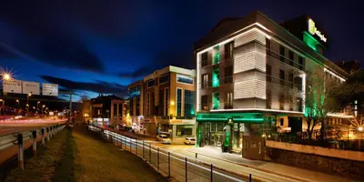 a building on a city street at night at Holiday Inn Istanbul - Kadikoy by IHG in Istanbul