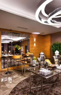 a lobby with tables with food on them at Holiday Inn Istanbul - Kadikoy by IHG in Istanbul