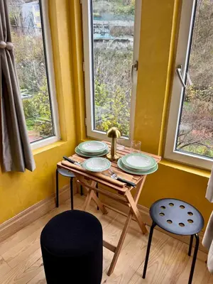 a room with a table with four plates on it at Historic Design 3-Storey Arnavutköy Home with Patio in Istanbul