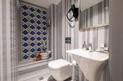 a bathroom with a white toilet and a sink at İstanbul Platine Apartment in Taksim