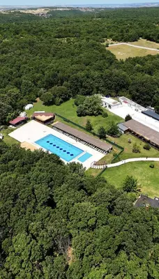 an overhead view of a large swimming pool in a field at The Life Nest Hotel in Saray