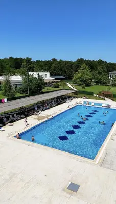an overhead view of a large swimming pool with people in it at The Life Nest Hotel in Saray