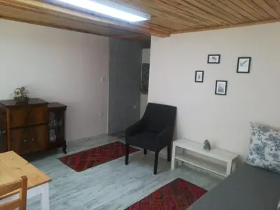 a living room with a chair and a table at La Casa25 in Istanbul