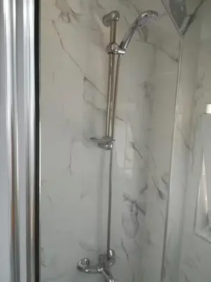 a shower with a glass door in a bathroom at La Casa25 in Istanbul
