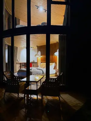 a bedroom with a bed and a table and chairs at Dream River Sapanca in Sapanca