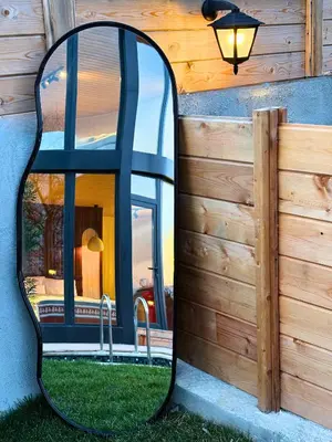 a large mirror on the side of a house at Dream River Sapanca in Sapanca