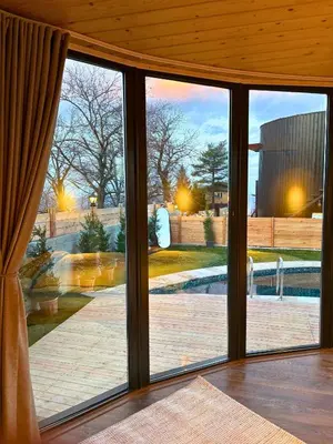 an open glass door with a view of a patio at Dream River Sapanca in Sapanca