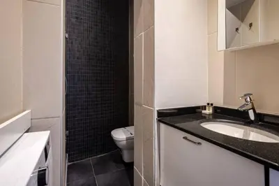 a bathroom with a sink and a toilet at Charming 2BD2Bath Galata Tower Unique Home! #409 in Istanbul