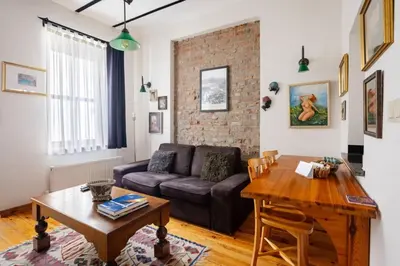 a living room with a couch and a table at Authentic Galata Tower Central 2BD2Bath Home #411 in Istanbul