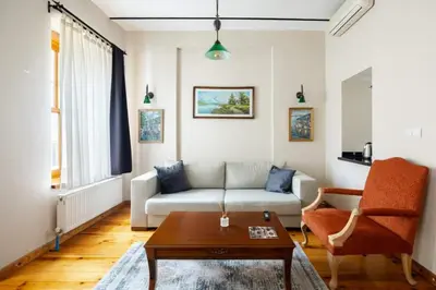 a living room with a couch and a coffee table at Cool Authentic 2BD2Bath Galata Tower Home! #413 in Istanbul