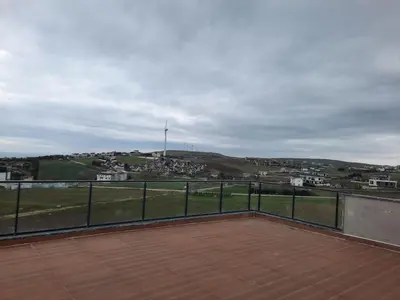 a balcony with a view of a city at Villa with private pool for daily rent in Istanbul in Buyukcekmece