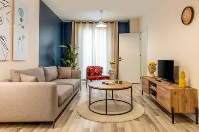 a living room with a couch and a table at Taksim Square - Apartment - Sleeps 4 - City Centre in Istanbul