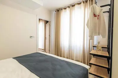 a bedroom with a bed and a ladder and a window at Taksim Square - Apartment - Sleeps 4 - City Centre in Istanbul
