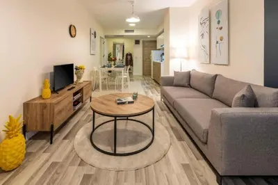 a living room with a couch and a table at Taksim Square - Apartment - Sleeps 4 - City Centre in Istanbul