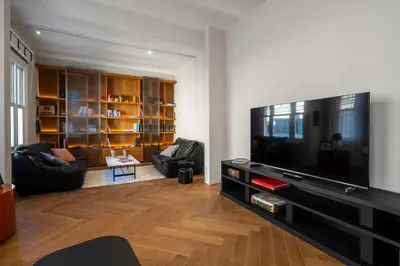 a living room with a large flat screen tv at The Muradiye Luxury Apartments in Istanbul