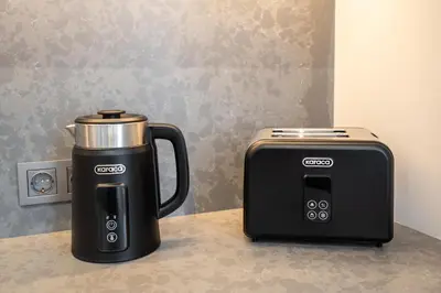 a coffee maker and a toaster sitting on a counter at The Muradiye Luxury Apartments in Istanbul