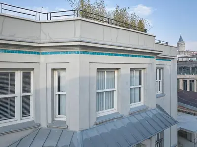 a white building with a balcony on top of it at The Muradiye Luxury Apartments in Istanbul
