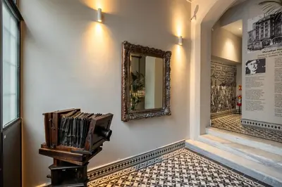 a mirror hanging on a wall next to a stairway at The Muradiye Luxury Apartments in Istanbul