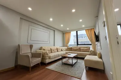 a living room with a couch and two chairs at Gold Suit - Bakırköy City Center in Istanbul