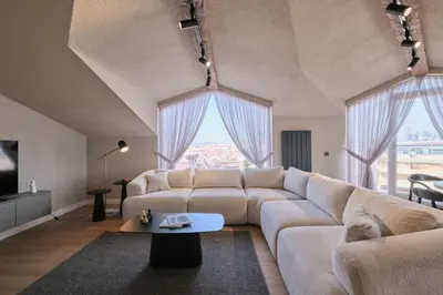 a living room with a couch and a table at BSY Flats Well Decorated Modern Apartments With 2BR, 3BR Options in Istanbul